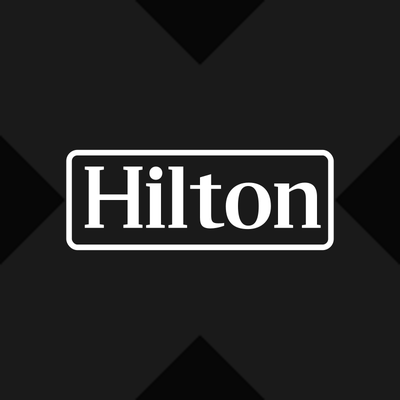 HLTx logo — tokenized Hilton Worldwide stock on Solana